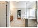 Bathroom featuring double doors, tile floors, a walk-in shower, and a closet at 5103 Trinity Trace Ln, Monroe, NC 28110