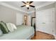 Bright bedroom featuring a closet, and an open door to an ensuite bathroom at 5103 Trinity Trace Ln, Monroe, NC 28110