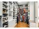Walk-in closet with custom shelving and ample storage space for organization and accessibility at 5103 Trinity Trace Ln, Monroe, NC 28110
