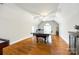 Large game room with high ceilings, hardwood floors, ping pong table, and natural light at 5103 Trinity Trace Ln, Monroe, NC 28110