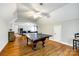 Spacious game room with hardwood floors, a ping pong table, and ample room for entertainment at 5103 Trinity Trace Ln, Monroe, NC 28110