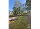 Spacious backyard featuring a grassy area and a wooden fence at 529 Tribune Dr, Charlotte, NC 28214