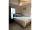 Bedroom featuring a carpet, ceiling fan, large window, and a white bed at 529 Tribune Dr, Charlotte, NC 28214
