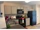 A kitchen featuring stainless steel appliances and gray cabinets for a sleek design at 529 Tribune Dr, Charlotte, NC 28214
