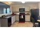 A kitchen with stainless steel appliances, gray cabinets, and tile flooring at 529 Tribune Dr, Charlotte, NC 28214