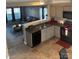 A kitchen and eat-in area featuring gray cabinets, stainless steel appliances, and tile flooring at 529 Tribune Dr, Charlotte, NC 28214