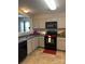 A kitchen featuring stainless steel appliances, gray cabinets, and tile flooring at 529 Tribune Dr, Charlotte, NC 28214