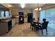 An eat-in kitchen featuring gray cabinets, stainless steel appliances, and tile flooring at 529 Tribune Dr, Charlotte, NC 28214