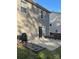 Cozy patio area with sliding glass doors, grill, and seating at 529 Tribune Dr, Charlotte, NC 28214