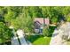 An aerial view of a well-maintained brick home surrounded by mature trees at 62 Pond View Ln, Fort Mill, SC 29715