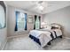Cozy bedroom with a brass bed frame, blue curtains, and a comfortable, carpeted floor at 62 Pond View Ln, Fort Mill, SC 29715