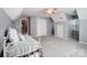 Bright bedroom showcasing sloped ceilings, a dormer window, and ample closet space at 62 Pond View Ln, Fort Mill, SC 29715