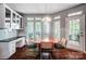 Bright breakfast nook features a built-in cabinet, a door to the backyard, and lots of natural light at 62 Pond View Ln, Fort Mill, SC 29715