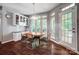 Charming breakfast nook with built-in cabinets, large windows, and access to the outdoor deck at 62 Pond View Ln, Fort Mill, SC 29715