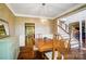 Cozy dining room with hardwood floors, classic wainscoting, and stairway views at 62 Pond View Ln, Fort Mill, SC 29715