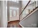 Inviting foyer with hardwood floors and a decorative glass front door at 62 Pond View Ln, Fort Mill, SC 29715