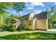 Exterior view of a house showing the screened porch and backyard, with mature trees at 62 Pond View Ln, Fort Mill, SC 29715