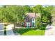 Two-story brick home with lush trees, green lawn, and a manicured landscape at 62 Pond View Ln, Fort Mill, SC 29715