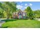 Attractive two-story brick home with a manicured front yard and vibrant green trees at 62 Pond View Ln, Fort Mill, SC 29715