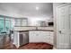 Well-lit kitchen with stainless steel appliances, ample counter space, and hardwood flooring at 62 Pond View Ln, Fort Mill, SC 29715