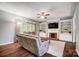 Cozy living room featuring a fireplace with built-in shelving and hardwood floors at 62 Pond View Ln, Fort Mill, SC 29715