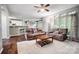 Spacious living room with hardwood floors and a view of the kitchen and backyard at 62 Pond View Ln, Fort Mill, SC 29715