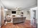 Comfortable living room with a fireplace, built-in shelving, and hardwood flooring at 62 Pond View Ln, Fort Mill, SC 29715