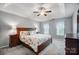 Spacious main bedroom with a ceiling fan, plush carpeting, and a neutral color palette at 62 Pond View Ln, Fort Mill, SC 29715