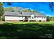 Well-maintained backyard with a wooden deck, ideal for outdoor entertaining and enjoying the peaceful surroundings at 6779 Highway 557 Hwy, Clover, SC 29710