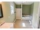 Bathroom with tub and shower combo, tiled floors, and single sink vanity at 6779 Highway 557 Hwy, Clover, SC 29710