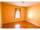 Bright bedroom featuring a window for natural light, hardwood floors, and neutral-toned walls at 6779 Highway 557 Hwy, Clover, SC 29710