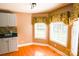Dining area boasting bright windows, hardwood floors, and built in shelving for convenience at 6779 Highway 557 Hwy, Clover, SC 29710