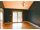 Dining room featuring hardwood floors, dark colored walls, and a chandelier lighting fixture at 6779 Highway 557 Hwy, Clover, SC 29710