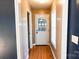 Light filled entryway with hardwood floors features a window and exterior glass panel door at 6779 Highway 557 Hwy, Clover, SC 29710