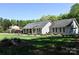 Inviting single-story house featuring a lush lawn and beautiful curb appeal at 6779 Highway 557 Hwy, Clover, SC 29710