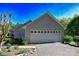 Spacious two-car garage provides ample parking and storage, complemented by neat landscaping at 6779 Highway 557 Hwy, Clover, SC 29710