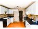 Bright kitchen featuring updated appliances, white cabinetry, and hardwood floors at 6779 Highway 557 Hwy, Clover, SC 29710