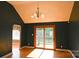 Open concept living room with hardwood floors, slider to back deck, and a chandelier at 6779 Highway 557 Hwy, Clover, SC 29710