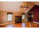Spacious living room featuring a fireplace and a ceiling fan for added comfort at 6779 Highway 557 Hwy, Clover, SC 29710