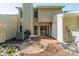 Backyard featuring a stone garden, patio, siding, and door to the home at 6809 Copernicus Cir, Charlotte, NC 28226