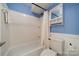 Clean, bright bathroom featuring a tub with shower and tile walls at 6809 Copernicus Cir, Charlotte, NC 28226