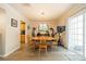 Bright dining area featuring a sliding glass door, creating a seamless indoor-outdoor living experience at 6809 Copernicus Cir, Charlotte, NC 28226