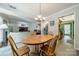 Bright dining room open to the living room and kitchen, perfect for gatherings and entertaining guests at 6809 Copernicus Cir, Charlotte, NC 28226