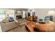 Inviting living room featuring a cozy fireplace, large windows, and comfortable seating for relaxation at 6809 Copernicus Cir, Charlotte, NC 28226