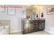 Well-lit bathroom featuring a large mirror and a granite countertop double sink vanity at 7023 Butternut Oak Ter, Huntersville, NC 28078