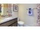 Stylish bathroom featuring a granite countertop vanity and decorative towel arrangement at 7023 Butternut Oak Ter, Huntersville, NC 28078