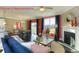Comfortable living room featuring a fireplace, large windows, and a view of the dining area at 7023 Butternut Oak Ter, Huntersville, NC 28078