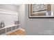 Mudroom entryway with a built-in bench, storage cubbies, and a decorative pillow at 7031 Butternut Oak Ter, Huntersville, NC 28078