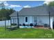 Backyard patio seating area with grill and fenced yard at 715 Cody Ct, Fort Mill, SC 29715