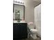 Bathroom featuring a black vanity with a decorative flower and neutral decor at 715 Cody Ct, Fort Mill, SC 29715